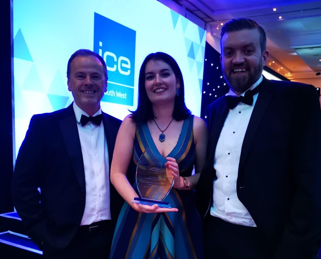 Maddie Eaves, Civil Engineer, celebrating her achievement with Rob Harrhy, Managing Director, and Mark Barrell, Associate Director, proudly holding her ICE South West Graduate of the Year 2024 award